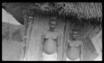 Two young women near a house