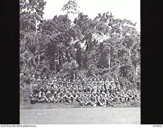 Group portrait of sixty one personnel of the 2/8th Commando Squadron. Back row, left to right: Corporal (Cpl) J M Seward (42); Trooper (Tpr) R Cater (43); Tpr W Thorne (44); Tpr W J Schwenke (45); ..