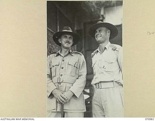 PORT MORESBY, PAPUA, 1944-03-13. VX20308 MAJOR-GENERAL F.H. BERRYMAN, CBE, DSO, GENERAL OFFICER COMMANDING 2ND AUSTRALIAN CORPS (1); WITH HIS AIDE-DE-CAMP QX2047 LIEUTENANT N.H. RUSSELL, DCM (2)