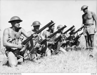 PORT MORESBY, PAPUA. 1942-07. TRAINING IN A BATTLE AREA. AUSTRALIAN INFANTRYMEN KEEP UP THEIR TRAINING AT "BATTLE STATIONS" IN NEW GUINEA