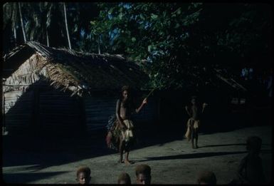 Arawe Island, in front of a house : New Britain coastline, Papua New Guinea, 1960 / Terence and Margaret Spencer