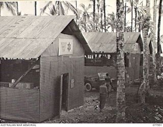 PALMALMAL PLANTATION, NEW BRITAIN. 1944-12-29. A SECTION OF THE AUSTRALIAN COMFORTS FUND STORES AT THE 5TH BASE SUB AREA. IDENTIFIED PERSONNEL ARE: CAPTAIN K. BOGLE, HONORARY COMMISSIONER (1); ..