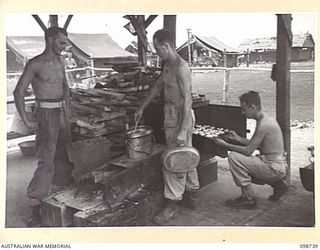 CAPE WOM, NEW GUINEA. 1945-11-14. CORPORAL K.T. ROBINSON (1); CORPORAL R.W. LAWRENCE (2); AND PRIVATE E.F. ARMSTRONG (3), COMPANY COOKS AT 6 DIVISION PROVOST COMPANY