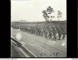 Port Moresby, Papua. 1944-08-05. A march past of the combined services Guard of Honour at the opening of the Bomana War Cemetery