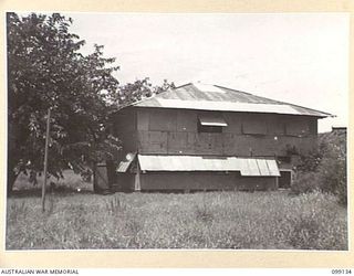 LAE, NEW GUINEA. 1945-11-3. GORDON EEKHOFF'S HOUSE AT LAE, THE ONLY DWELLING WHICH SURVIVED BOTH JAPANESE AND ALLIED BOMBING. IT IS BELIEVED TO HAVE BEEN USED AS A GEISHA HOUSE DURING THE JAPANESE ..