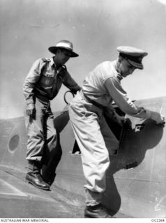 TOROKINA, BOUGAINVILLE ISLAND, SOLOMON ISLANDS. 1945-02-18. CHIEF OF AIR STAFF AIR VICE-MARSHAL JONES CB CBE DFC (RIGHT) INSPECTING A BEAUFREIGHTER AIRCRAFT OF NO. 10 COMMUNICATION UNIT RAAF AT ..