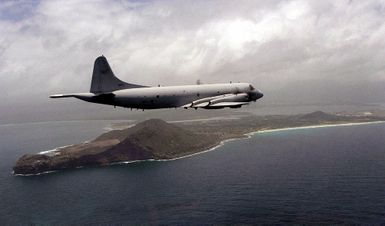 A Republic of Korea Navy P-3C Orion flies over Kaneohe Bay, Hawaii enroute to a missile firing exercise during RIMPAC '98