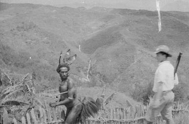 Man approaching Papuan, first contact, Papua New Guinea, April 1930 / Michael Leahy
