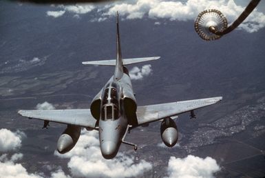 An A-4 Skyhawk aircraft maneuvers into position to be refueled in flight during Exercise COPE CANINE '85