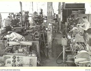 PORT MORESBY, NEW GUINEA. 1944-04-10. THE MACHINE SHOP AT THE 11TH ADVANCED WORKSHOP, AUSTRALIAN ELECTRICAL AND MECHANICAL ENGINEERS