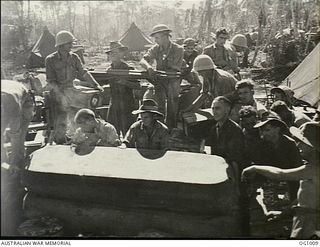 AITAPE, NORTH EAST NEW GUINEA. C. 1944-04. RAAF AIRMEN UNPACK EQUIPMENT FOR A MOBILE MEDICAL CLEARING STATION WHICH LANDED WITH AMERICAN ASSAULT TROOPS