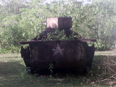 A Landing Vehicle Tracked (Armored)(Mark 1), LVT(A)-1 left after the Battle of Peleliu during World War Two on the island of Peleliu. Photograph taken as part of Exercise KOA THUNDER 2001. Marines from Aviation Support Element, Kaneohe Bay Hawaii, 1ST Marine Air Wing, Okinawa, Japan, and 3rd Marines 7th Battalion, 29 Palms, California, participated in KOA THUNDER on the island of Guam from July 9 to July 14. The purpose of the exercise was to demonstrate the Marine Corps ability to deploy in the South Pacific from places other than Okinawa, Japan