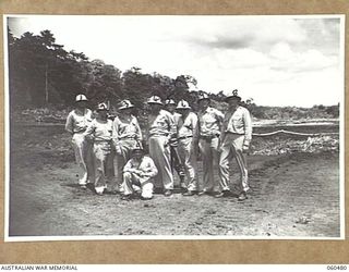 FINSCHHAFEN AREA, NEW GUINEA. 1943-11-11. SENIOR OFFICERS OF THE UNITED STATES ARMY POSE FOR A PHOTOGRAPH AFTER INSPECTING THE NEW BOMBER AIRSTRIP WHICH IS BEING JOINTLY BUILT BY THE 808TH UNITED ..