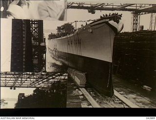 QUINCY, MASSACHUSETTS. USA. 1943-04-19. PORT BOW VIEW OF THE CRUISER USS CANBERRA (CA-70) IMMEDIATELY PRIOR TO HER LAUNCH AT THE FORE RIVER YARD OF THE BETHLEHEM STEEL COMPANY. SHE WAS NAMED TO ..