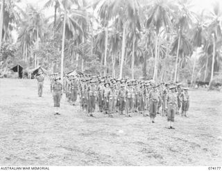 SIAR, NEW GUINEA. 1944-06-22. PERSONNEL OF C COMPANY, 57/60TH INFANTRY BATTALION, ON THE UNIT PARADE GROUND. IDENTIFIED PERSONNEL ARE:- VX114142 CAPTAIN J.H. NEWSTEAD (1); VX81112 LIEUTENANT G.H. ..