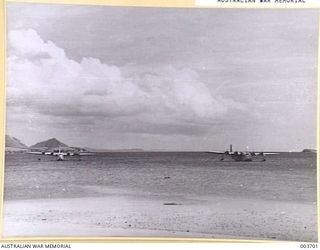 PORT MORESBY - SMOOTH OCEAN OFF ELA BEACH, THIS EXCELLENT LANDING AREA IS FLYING BOAT ANCHORAGE, ESPECIALLY DURING N.W. MONSOON PERIOD. RAAF SURVEY FLIGHT. (NEGATIVE BY N. TRACY)