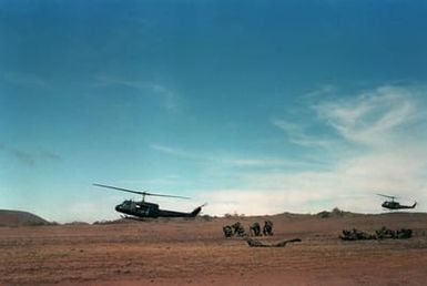 UH-1 Iroquois helicopters are used by members of Company A, 1ST Battalion, 5th Infantry, 25th Infantry Division, as they conduct an airmobile assault on opposing forces during exercise OPPORTUNE JOURNEY 4-84 at Pohakuloa Training Area