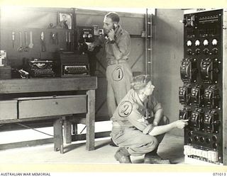 PORT MORESBY, PAPUA, NEW GUINEA. 1944-03-13. THE WHEATSTONE POWER ROOM AND WORKSHOP AT THE 18TH LINES OF COMMUNICATION SIGNALS, HEADQUARTERS NEW GUINEA FORCE. IDENTIFIED PERSONNEL ARE:- NX143295 ..