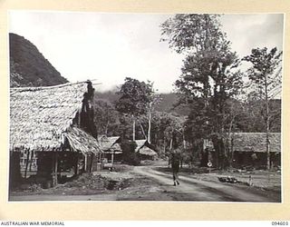NANTAMBU, NEW BRITAIN, 1945-07-26. SCENE ON ROAD NEAR BATTALION HEADQUARTERS, LOOKING TOWARDS 4 FIELD AMBULANCE CAMP AT NANTAMBU