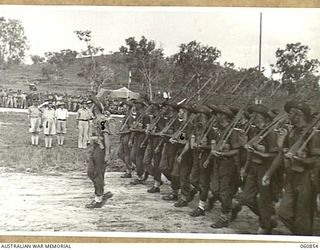 NEW GUINEA. 1943-11-20. NX8 LIEUTENANT GENERAL SIR LESLIE MORSHEAD KCB KBE CMG DSO ED, GENERAL OFFICER COMMANDING, NEW GUINEA FORCE (1), TAKING THE SALUTE FROM UNITS OF THE 18TH AUSTRALIAN INFANTRY ..