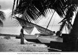 William Allen and Rongelap men launching an outrigger boat, summer 1964