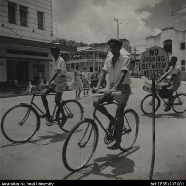 Men riding bicycles