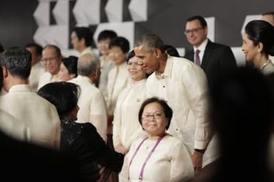 Barack Obama joins Asia Pacific Economic Cooperation Summit leaders and spouses for a group photo in Pasay, Metro Manila, Philippines, November 18, 2015