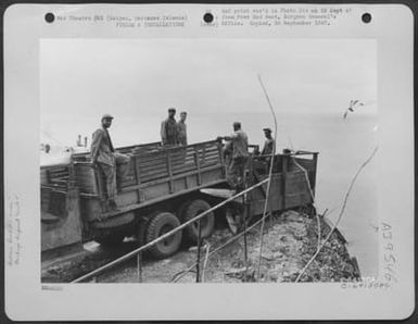 Truck Is Backed Up To Garbage Rack And Then Rubbish Is Dumped Into The Sea, Saipan, Marianas Islands. (U.S. Air Force Number C64130AC)