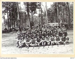 Group portrait of members of 5 Platoon, Headquarters Company, 58/59 Infantry Battalion. Identified, back row, left to right: Private (Pte) B Bradshaw; Pte H McIntosh; Pte L McIntosh; Pte A ..