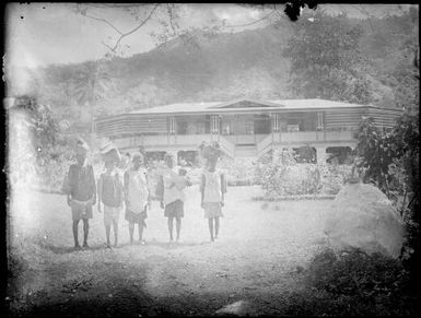 Five laden women standing in front of Chinnery's house, Malaguna Road, Rabaul, New Guinea, ca. 1935 / Sarah Chinnery