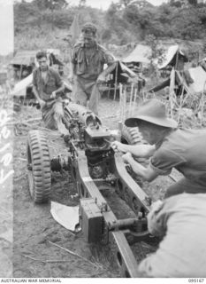 KIARIVU, NEW GUINEA, 1945-08-11. A 75MM GUN MANNED BY A BATTERY, 2/1 TANK ATTACK REGIMENT, ROYAL AUSTRALIAN ARTILLERY, IN POSITION ON THE EMERGENCY LANDING GROUND. THEY ARE SUPPORTING 2/7 INFANTRY ..