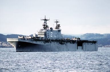 A port bow view of the amphibious assault ship USS SAIPAN (LHA-2) at anchor off the coast of Norway during NATO exercise Northern Wedding '86