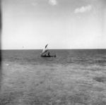 Canoe running back to the village from the outer islets