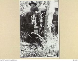 PORT MORESBY, PAPUA. 1942-07. WASHING DAY. AUSTRALIAN TROOPS IN NEW GUINEA, UNLIKE THOSE THAT FOUGHT IN LIBYA, FIND A PLENTIFUL SUPPLY OF WATER FOR THEIR DOMESTIC PURPOSES