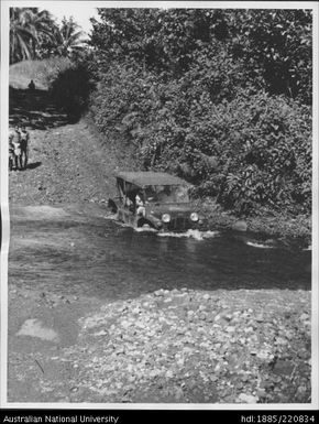 Crossing a river on the road from Popondetta to Ssiho