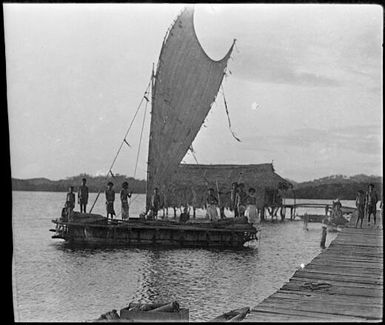 Lakatoi beside jetty with a marine house behind, Papua, ca. 1923 / Sarah Chinnery