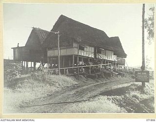 ILOLO, NEW GUINEA, 1944-03-30. THE MEN'S BILLETS AT THE AUSTRALIAN NEW GUINEA ADMINISTRATIVE UNIT NATIVE LABOUR CAMP