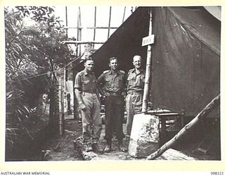 NAMANULA, NEW BRITAIN. 1945-10-22. WARRANT OFFICER 2 D. BEACOM (1), CAPTAIN R.J. MCINTYRE (2) AND PRIVATE G.S. BUCKLAND (3), MEMBERS OF THE AUSTRALIAN ARMY CATERING CORPS, HEADQUARTERS 11 DIVISION