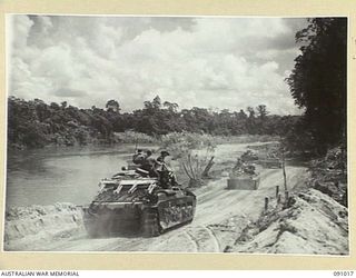 BOUGAINVILLE. 1945-04-16. MATILDA TANKS OF B SQUADRON, 2/4 ARMOURED REGIMENT ATTACHED 3 DIVISION, MOVING ALAONG THE BUIN ROAD SOUTH OF THE PURIATA RIVER TO SUPPORT THE INFANTRY ADVANCE TOWARDS THE ..