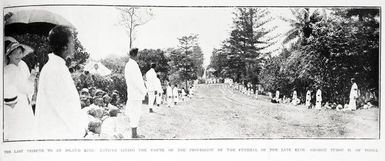 The last tribute of an island king: natives lining the route of the procession of the funeral of the late King George Tubou ii, of Tonga