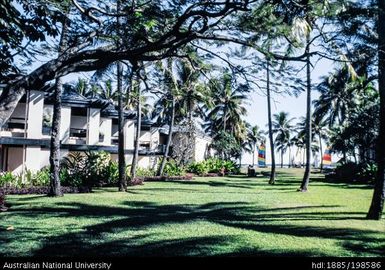 Fiji - waterside resort, blue buildings with black roofs and details