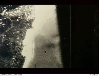 Gasmata, New Britain. 1943-07-20. Aerial photograph of the Japanese airfield unserviceable after numerous strikes by Beaufighter aircraft of No. 30 Squadron RAAF. (Donor F. Cassidy)