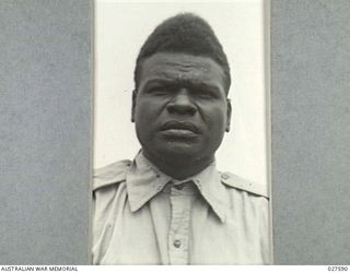CLIFTON GARDENS, SYDNEY, AUSTRALIA. 1942-12. CLOSE UP OF A NATIVE OF THE PACIFIC ISLANDS SERVING WITH 1 AUSTRALIAN WATER TRANSPORT GROUP, ROYAL AUSTRALIAN ENGINEERS ON SMALL CRAFT
