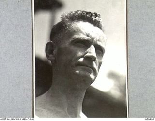 17 MILE, LALOKI RIVER, NEW GUINEA. 1943-11-22. NX24379 STAFF SERGEANT L. H. PICKERING, NON COMMISSIONED OFFICER IN CHARGE OF THE CORDIAL FACTORY ESTABLISHED AND OPERATED BY PERSONNEL OF THE ..