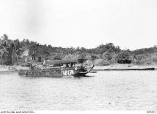 KALAI PLANTATION, NEW BRITAIN. 1945-02-21. AB1074 THE HOSPITAL BARGE OF THE 1ST WATER AMBULANCE CONVOY WHICH RUNS A SERVICE BETWEEN THE TWO UNITS OF THE 4TH FIELD AMBULANCE, THE ADVANCED DRESSING ..