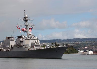 The U.S. Navy Arleigh Burke Class Guided Missile Destroyer USS RUSSELL (DDG 59) passes the USS ARIZONA Memorial (right) as it returns home at Naval Station Pearl Harbor, Hawaii, on Sept. 5, 2006, following a six-month deployment. RUSSELL departed this year as part of the Abraham Lincoln Carrier Strike Group and later joined the USS KITTY HAWK CSG before returning here at Pearl Harbor. (U.S. Navy photo by Mass Communication SPECIALIST 1ST Class James E. Foehl) (Released)