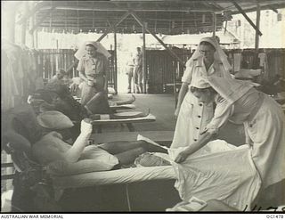 MILNE BAY, PAPUA. C. 1944-02. RAAF NURSING SISTERS AND PATIENTS IN A HOSPITAL WARD AT NO. 2 MEDICAL CLEARING STATION RAAF