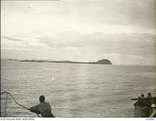 AITAPE AREA, NORTH EAST NEW GUINEA. C. 1944-04-22. US AND RAAF TROOPS WATCHING THE APPROACH TO KORAKO VILLAGE NEAR AITAPE FROM THE DECK OF A LANDING SHIP, TANK (LST)