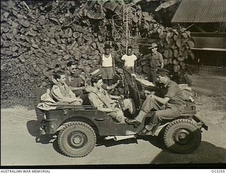 TOROKINA, BOUGAINVILLE ISLAND, SOLOMON ISLANDS. 1945-08-08. SCRAMBLE! PILOTS OF NO. 5 (BOOMERANG) SQUADRON LEAVING THEIR JUNGLE OPERATIONS ROOM FOR THEIR AIRCRAFT BEFORE TAKING OFF ON A STRIKE. ..