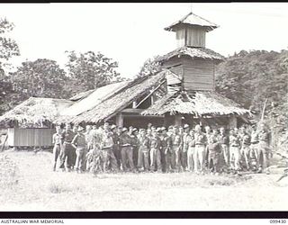 LAE, NEW GUINEA, 1945-12-09. MEMBERS OF THE CONGREGATION OUTSIDE THE ENTRANCE TO THE ROMAN CATHOLIC CHAPEL, 112 CONVALESCENT DEPOT